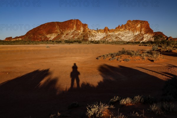 Dark shadows against the contrasting landscape of Rainbow Valley when the sun is low, Rainbow Valley, Northern Territory, Australia