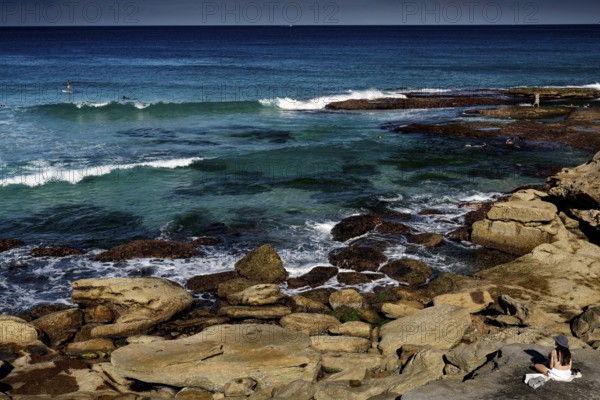 Rocky coastline and rough sea at Tamarama Point, Sydney, NSW, Australia