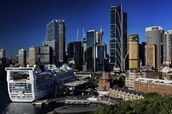 View of Sydney skyline with a large cruise ship in the foreground, Sydney, New South Wales, Australia