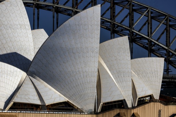 Detailed close-up of the Sydney Opera House façade in front of the bridge, Sydney, New South Wales, Australia