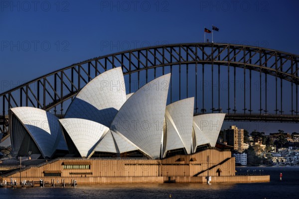 Sydney Opera House in front of Harbour Bridge in daylight, Sydney, New South Wales, Australia