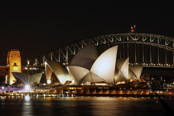 Illuminated Sydney Opera House and Harbour Bridge at night, Sydney, New South Wales, Australia