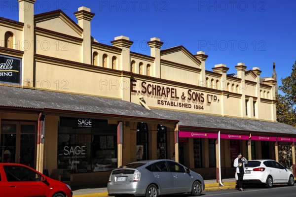 Historic building on Tanunda's main street with signs and shop windows, Tanunda, South Australia, Australia