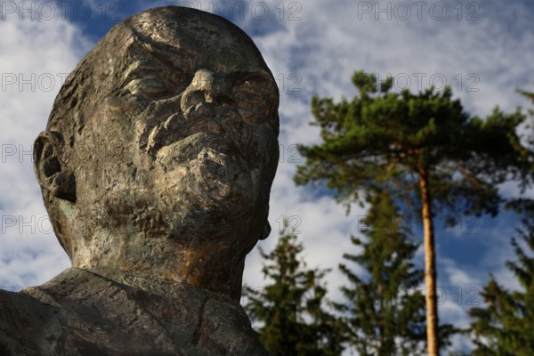 Large bust of Lenin in Grutas Park in Druskininkai under a blue sky, Druskininkai, Lithuania