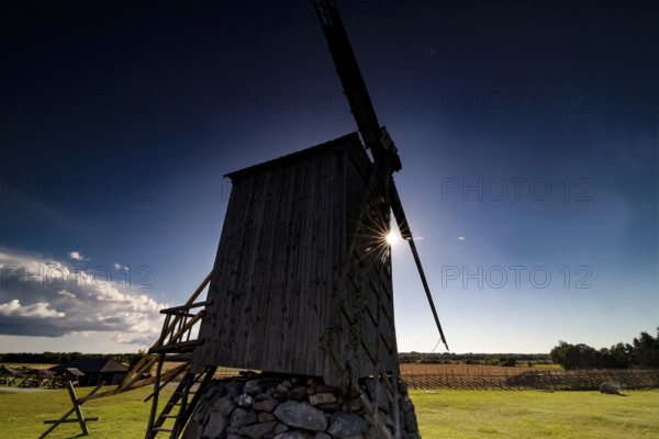 Silhouette of a mill in Angla at sunset on Saaremaa Island, Angla, Saaremaa, Estonia
