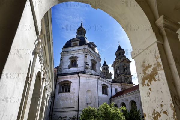 Baroque Pažaislis monastery with towers and arches under blue sky, Kaunas, Kauno apskritis, Lithuania