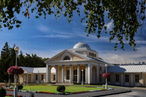 Elegant spa and hotel building in classical style with colonnades against a blue sky, Pärnu, Pärnu County, Estonia