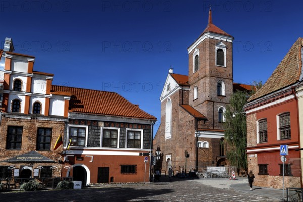 Historic buildings on Town Hall Square, Rathausplatz, Rathausplatz with an impressive cathedral under clear skies, Kaunas, Kaunas County, Lithuania