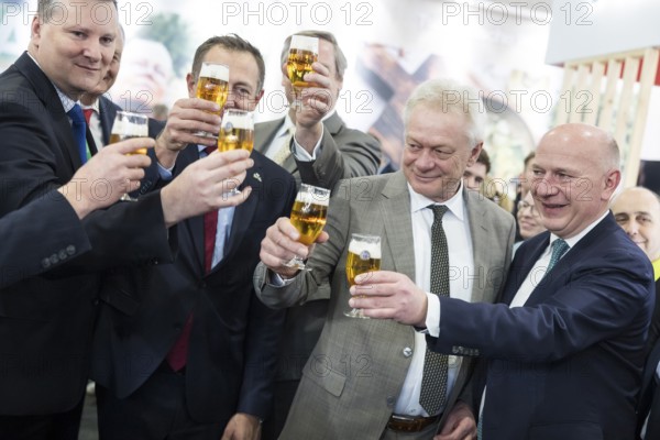 Alios Rainer (Federal Minister of Agriculture, Food and Home Affairs) and Kai Wegner (Governing Mayor of Berlin) toast with beer at the Polish stand during the opening tour of the Green Week at the exhibition grounds in Berlin on 16 January 2026. The trade fair for the agricultural and food industry will take place from 16 to 25 January 2026