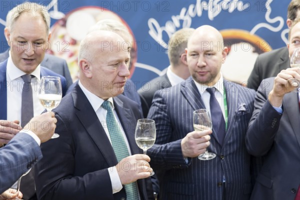 Kai Wegner (Governing Mayor of Berlin) with a glass of wine in his hand at Ukraine's stand during the opening tour of the Green Week at the exhibition grounds in Berlin on 16 January 2026. The trade fair for the agricultural and food industry will take place from 16-25 January 2026