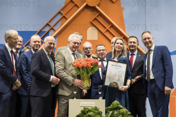 Jean Rummenie (Minister of Agriculture, Food Security, Fisheries and Nature) and Femke Marije Wiersma (Minister of Agriculture, Fisheries and Nature) together with Alios Rainer (Federal Minister of Agriculture, Food and Home Affairs), Kai Wegner (Governing Mayor of Berlin), Joachim Rukwied (President of the German Farmers' Association e. V.), Christophe Hansen (Commissioner for Agriculture and Rural Development) and Mario Tobias (CEO of Messe Berlin) in the hall of the Netherlands at the opening tour of the Green Week on the exhibition grounds in Berlin.V.), Christophe Hansen (Commissioner for Agriculture and Rural Development) and Mario Tobias (CEO of Messe Berlin) in the hall of the Netherlands during the opening tour of the Green Week at the exhibition grounds in Berlin on 16 January 2026. The trade fair for the agricultural and food industry will take place from 16 to 25 January 2026