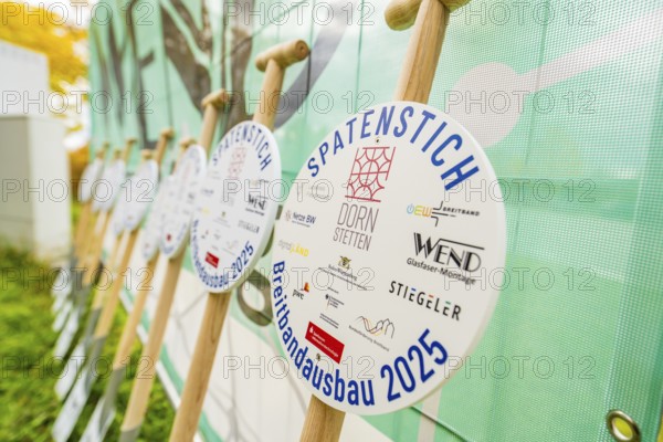 Several signs printed with logos announcing broadband expansion in 2025, fiberglass groundbreaking, Dornstetten, Freudenstadt, Germany