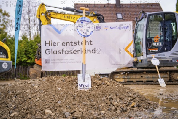Construction site for fibre-optic expansion with excavators and signs in the background, fiberglass groundbreaking, Dornstetten, Freudenstadt, Germany
