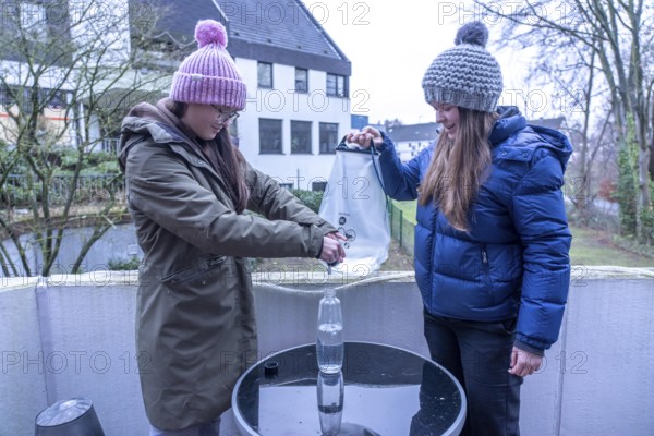 Symbolic picture blackout, extensive, prolonged power failure, in the private environment, without electricity, the water supply also fails, rainwater is made drinkable with the help of a water filter