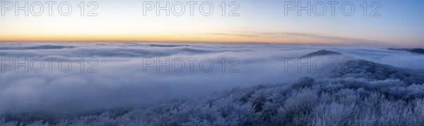 Wide, snowy landscape under a calm sky at dusk, panoramic view of the Teutoburg Forest from an elevated position, Steinegge observation tower, Dissen, Osnabrück district, Lower Saxony, Germany