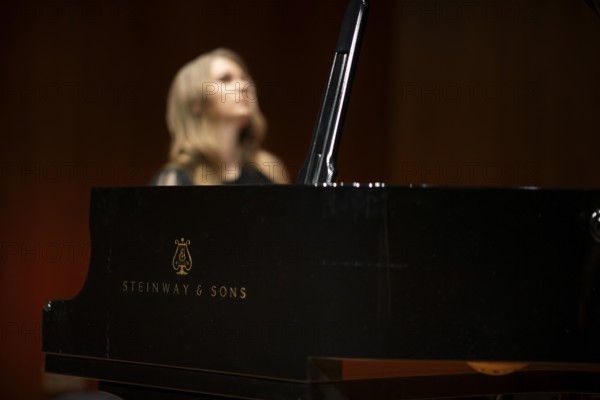 Young woman, pianist playing on a Steinway & Sons grand piano, Stuttgart, Baden-Württemberg, Germany