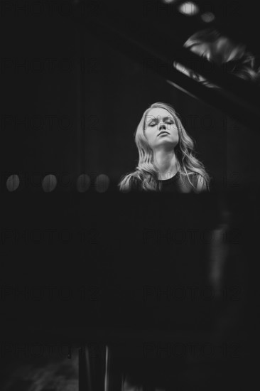 Young woman, pianist, with concentrated facial expression and closed eyes playing on a Steinway & Sons grand piano, Stuttgart, black and white photo, Stuttgart, Baden-Württemberg, Germany