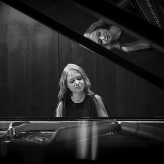 Young woman, pianist playing on a Steinway & Sons grand piano, black and white recording, Stuttgart, Baden-Württemberg