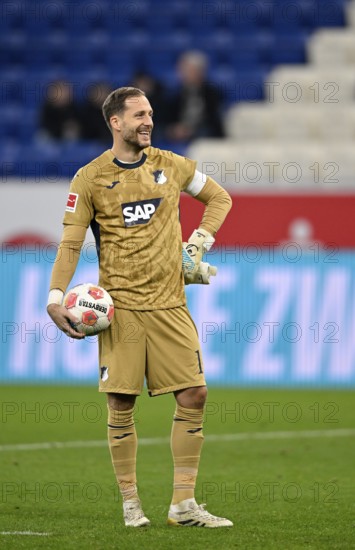 Goalkeeper Oliver Baumann TSG 1899 Hoffenheim (01) with match ball smiles PreZero Arena, Sinsheim, Baden-Württemberg, Germany