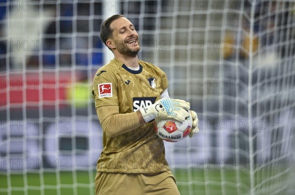 Goalkeeper Oliver Baumann TSG 1899 Hoffenheim (01) with ball smiling PreZero Arena, Sinsheim, Baden-Württemberg, Germany