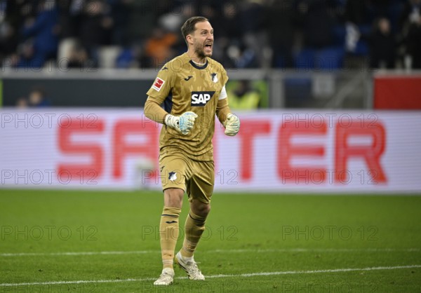 Goal celebration goalkeeper Oliver Baumann TSG 1899 Hoffenheim (01) in the background perimeter advertising logo SAUTER PreZero Arena, Sinsheim, Baden-Württemberg, Germany