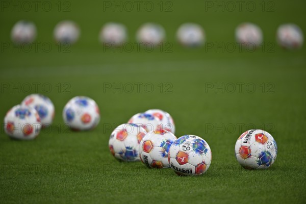 Adidas Derbystar game balls are lying on grass, PreZero Arena, Sinsheim, Baden-Württemberg, Germany