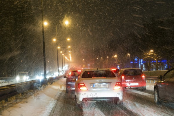 Traffic jam, city traffic due to snow flurries, blowing snow, Upper Bavaria, Germany