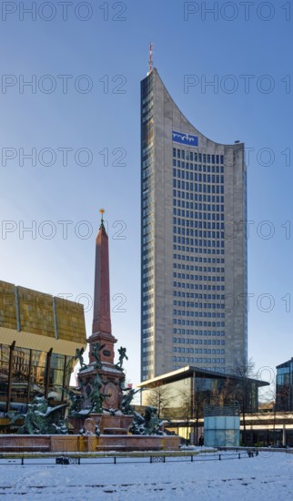 Mendebrunnen, Gewandhaus and City Tower on Augustusplatz in winter with snow, Leipzig, Saxony, Germany