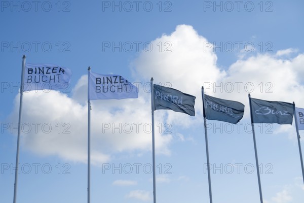 Flags against a blue sky with clouds, writing Binzer Bay and Prora, Binz, seaside resort, Rügen island, Mecklenburg-Western Pomerania, Germany