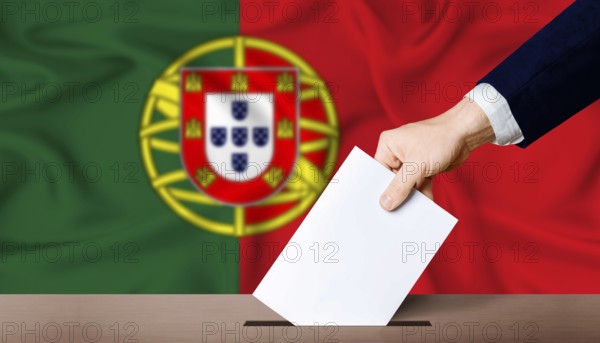 Portugal presidential vote 2026. Hand placing a ballot in ballot box with the Portuguese flag in the background