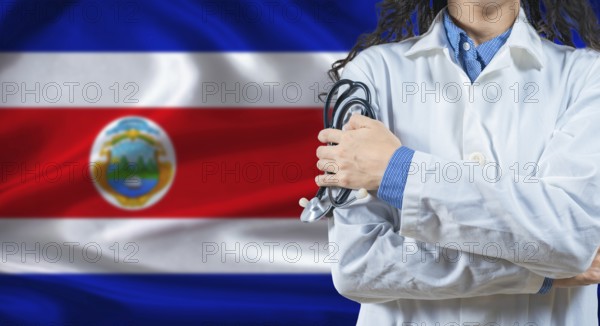 Healthcare professional with Costa Rica flag background. Professional doctor holding stethoscope on Costa Rica flag background