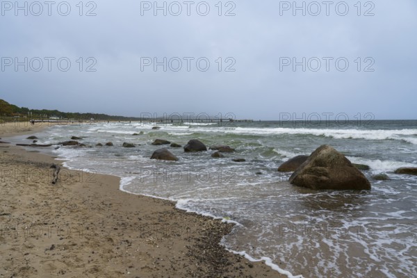 Boulders and waves on the coast, sandy beach, Baltic resort Göhren, Baltic Sea, Rügen island, Mecklenburg-Western Pomerania, Germany
