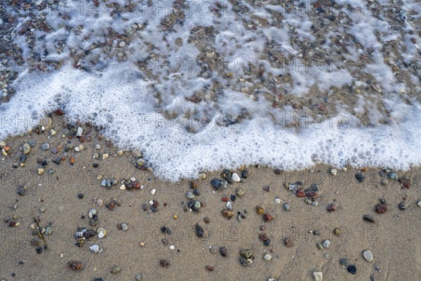 Pebbles on the coast surrounded by water, view from above, Baltic Sea, Rügen island, Mecklenburg-Western Pomerania, Germany
