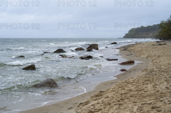 Boulders and waves on the coast, sandy beach, Nordperd, Baltic resort Göhren, Baltic Sea, Rügen island, Mecklenburg-Western Pomerania, Germany