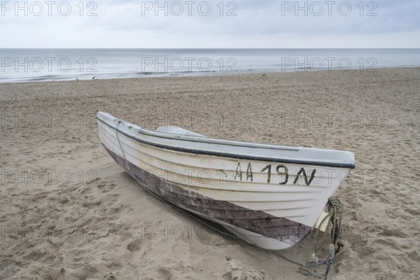 Boat is located on a sandy beach, Baltic resort Göhren, Baltic Sea, Rügen Island, Mecklenburg-Western Pomerania, Germany