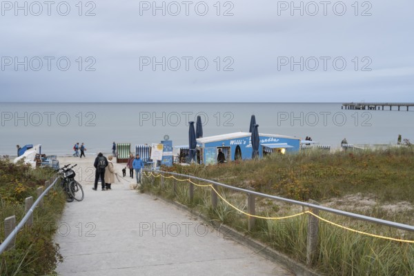 Beach exit and beach bar at dusk, Binz, seaside resort, Rügen island, Baltic Sea, Mecklenburg-Western Pomerania, Germany