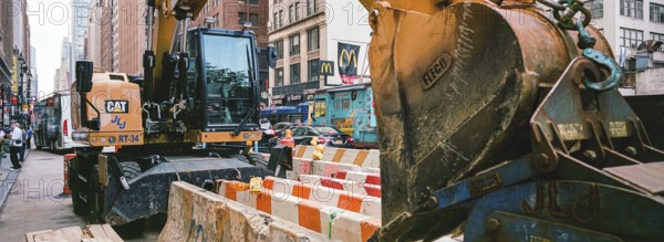 Excavator in front of the New Yorker Hotel, New York, USA