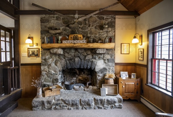 Interior view, fireplace in Manager's House, now Visitor Center, former Gold Mine Independence Mine building in mountainous landscape, Independence Mine State Historical Park, Hatcher Pass, Talkeetna Mountains, Alaska, USA