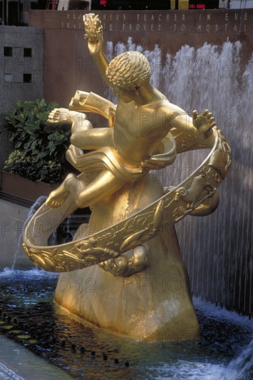 Gold-colored Prometheus statue in Rockefeller Center, New York City, USA
