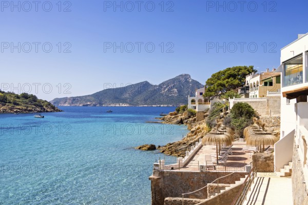 House with terraces on the shores of the Mediterranean sea with a scenics view to the sea a sunny summer day, Sant Elm, Mallorca, Spain