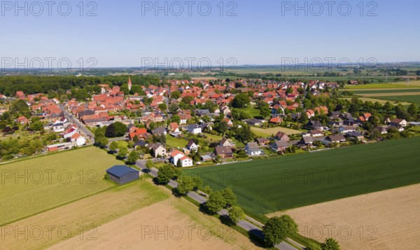 Panoramic summer view of a village with red roofs and wide fields, Adenstedt, Ilsede municipality, Peine district, Lower Saxony, Germany