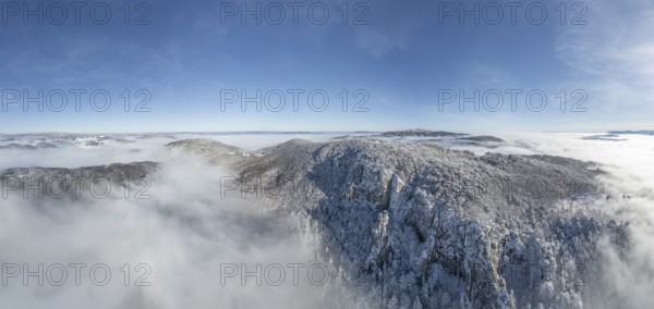 Aerial view of snowy stone walls and fog in the valley, Schwarzensee, Weissenbach an der Triesting, Lower Austria, Austria