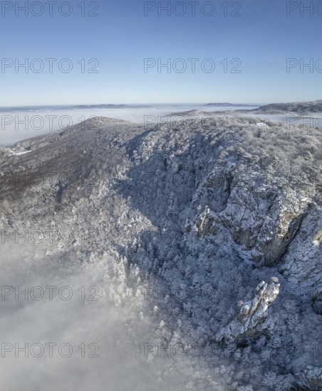 Aerial view of snowy stone walls and fog in the valley, Schwarzensee, Weissenbach an der Triesting, Lower Austria, Austria