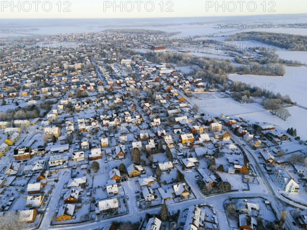 Winter aerial view of a village with snowy houses and landscapes in the background, Aerial view, Oelsburg, Ilsede, Peine District, Lower Saxony, Germany