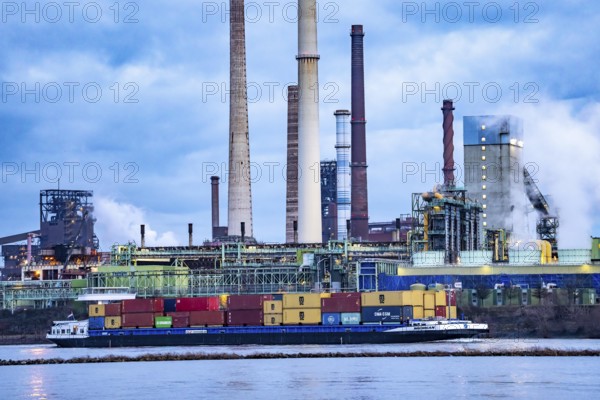 Shipping traffic on the Rhine near Duisburg-Bruckhausen, industrial setting of the ThyssenKrupp steel plant, Schwelgern coking plant, North Rhine-Westphalia, Germany