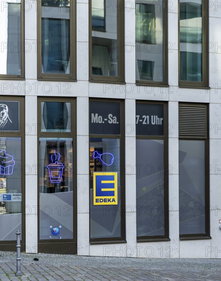 Yellow-blue Edeka company logo on a new building on Invalidenstraße in Mitte, Berlin, Germany