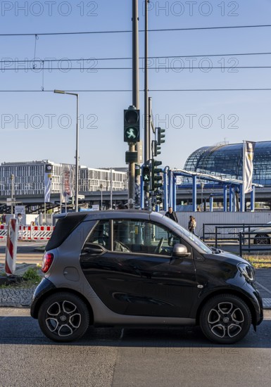 Berlin road traffic with buses, trams and pedestrians at and around the main train station, Berlin, Germany