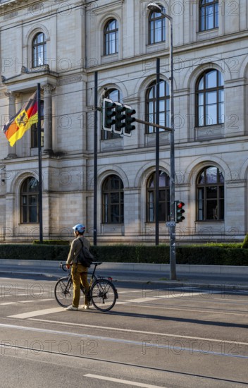 Cyclists on Invalidenstraße in front of the Federal Ministry of Economics and Energy building, Berlin, Germany