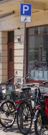 Parking space for disabled people blocked by bicycles, Potsdam, Brandenburg, Germany
