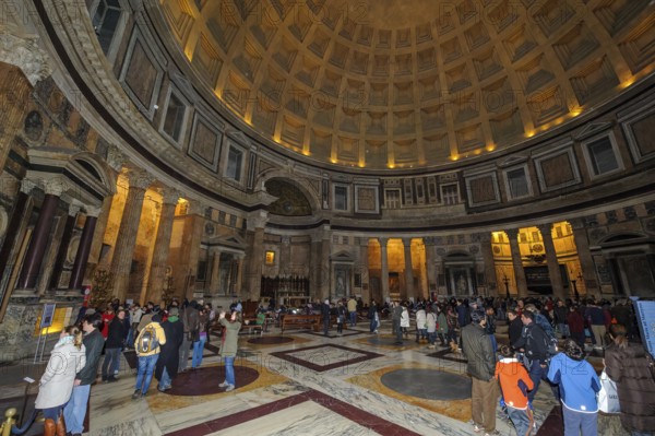Tourist flow of visitors in Pantheon interior of ancient Roman temple with dome, coffered ceiling, Rome, Lazio, Italy